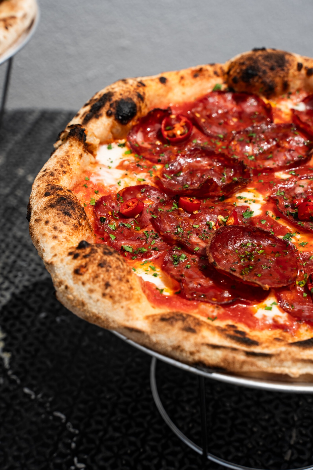 Close-up of a pepperoni pizza from the traditional pizza oven